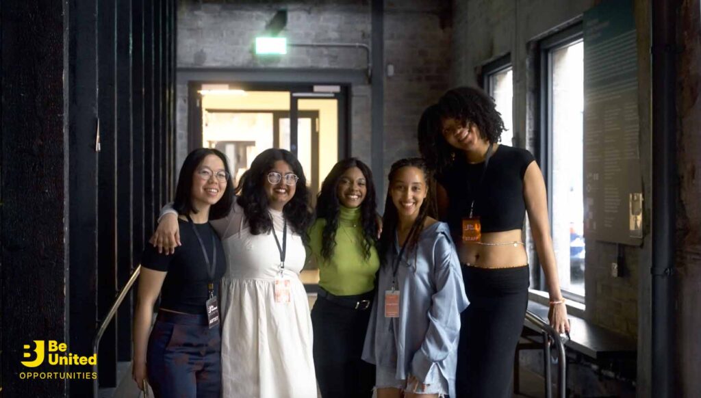 A group shot of some of the Producing the Future participants with their tutor Serena Piotto, standing at a the event venue. 